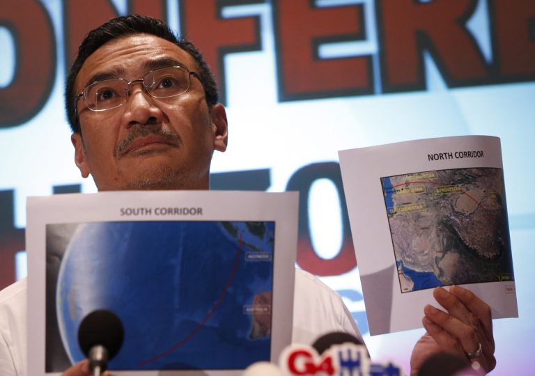Malaysia's acting Transport Minister Hishamuddin Hussein shows maps of southern corridor and northern corridor of the search and rescue operation during a press conference at a hotel near the Kuala Lumpur International Airport, in Sepang, Malaysia, Monday, March 17, 2014. Twenty-six countries are involved in the massive international search for the Malaysia Airlines jetliner that disappeared on March 8 with 239 people aboard. They include not just military assets on land, at sea and in the air, but also investigators and the specific support and assistance requested by Malaysia, such as radar and satellite information. (AP Photo/Vincent Thian)