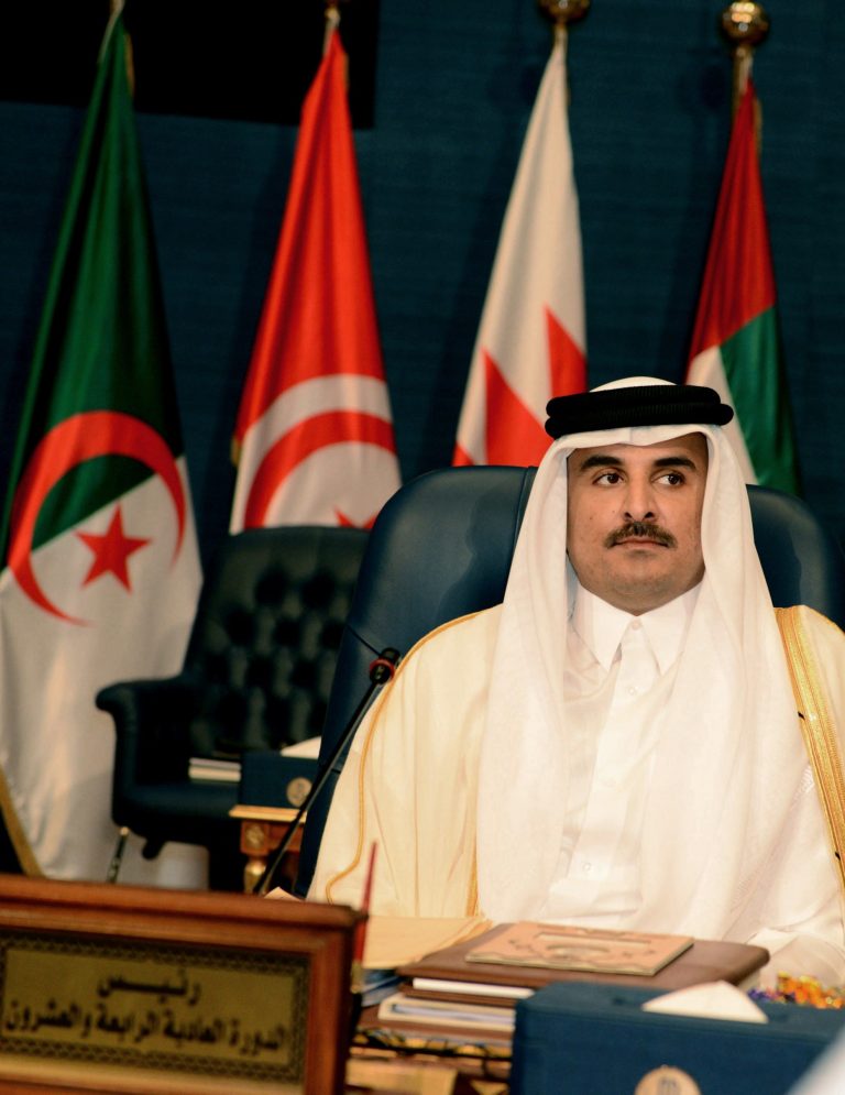 Emir of Qatar Sheik Tamim bin Hamad bin Khalifa Al Thani, listens during the opening session of the Arab League Summit in Bayan Palace, Kuwait City, Tuesday, March 25, 2014. Qatar's ruler is critical of Iraq's Shiite-led government and Egyptian authorities in an address to an Arab summit in Kuwait.(AP Photo/Nasser Waggi)