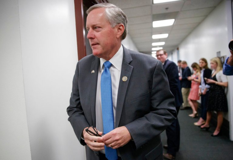 FILE - In this March 28, 2017, file photo, House Freedom Caucus Chairman Rep. Mark Meadows, R-N.C walks on Capitol Hill in Washington. A key part of House Republicans' plan to overhaul the way corporations pay taxes is on life support, leaving lawmakers scrambling to save one of President Donald Trump's biggest priorities and increasing the chances the GOP will simply pass a tax cut instead of overhauling the tax code.