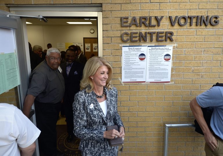 Texas gubernatorial Democratic candidate Wendy Davis exits the Early Voting Center after casting her vote on the first day of early voting at the Charles Griffin Sub-Courthouse, in Fort Worth, Texas,  Monday, Oct. 20, 2014.  Davis is running against against Republican Texas Attorney General Greg Abbott. U.S. Rep. (AP Photo/The Fort Worth Star-Telegram, Max Faulkner)  MAGS OUT; (FORT WORTH WEEKLY, 360 WEST); INTERNET OUT