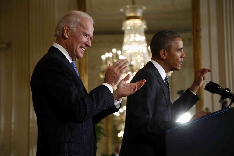 Vice President Joe Biden applauds as President Barack Obama speaks about immigration reform, Thursday, Oct. 24, 2013, in the East Room of the White House in Washington. The president said now that the partial government shutdown is over, Republicans and Democrats should be able to work together to fix what he called 