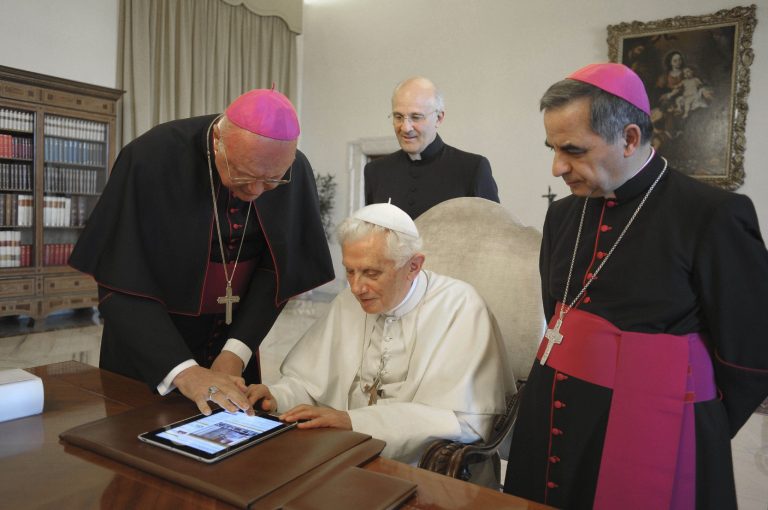   FILE - In this June 28, 2011 file photo, Pope Benedict XVI touches a touchpad to send a tweet for the launch of the Vatican news information portal 