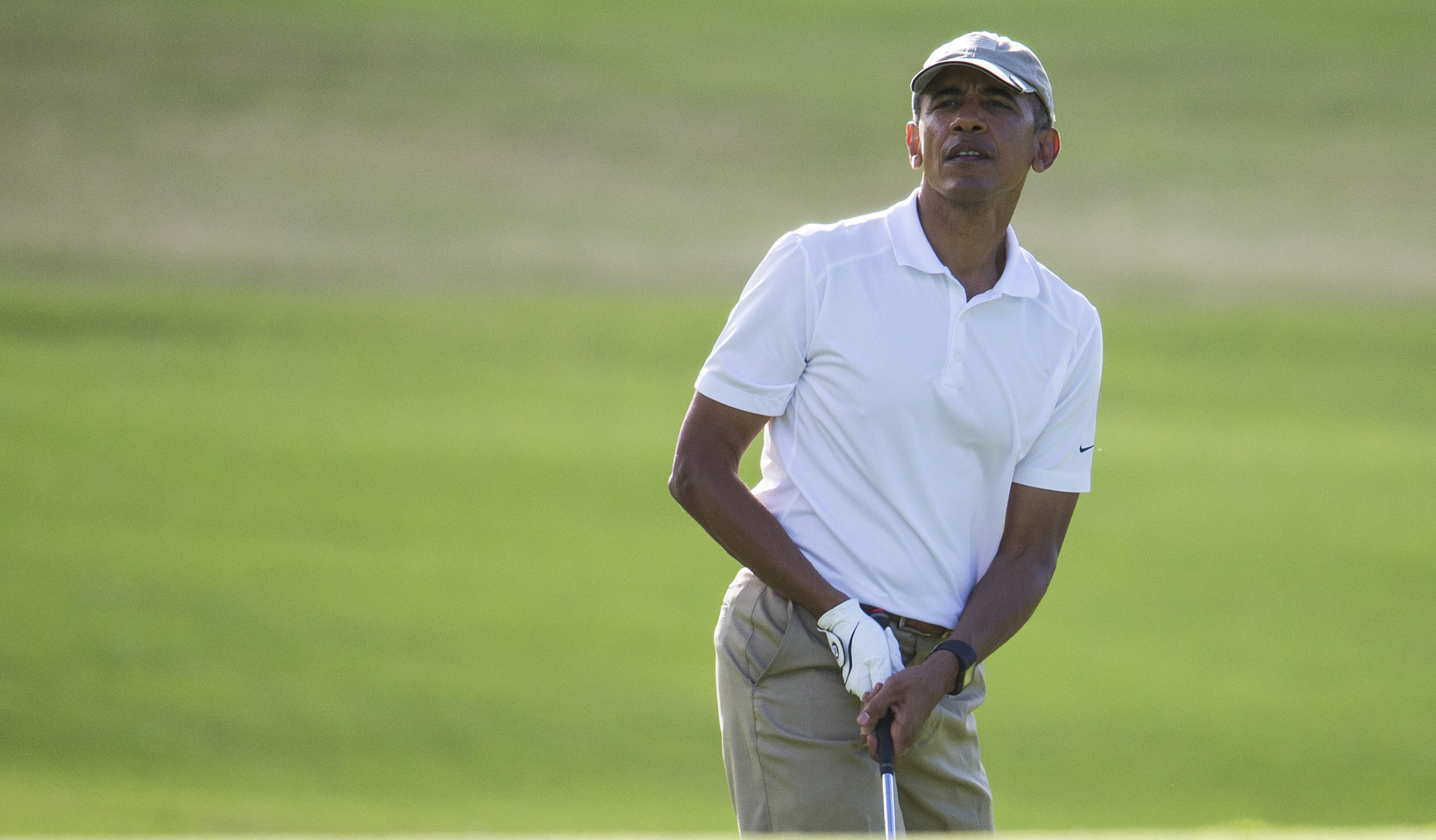 Obama hits golf course hours after arriving in Hawaii