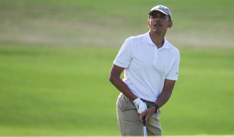 President Obama wasted little time on his final holiday vacation in Hawaii before hitting the golf course Saturday morning. (AP Photo/Evan Vucci)