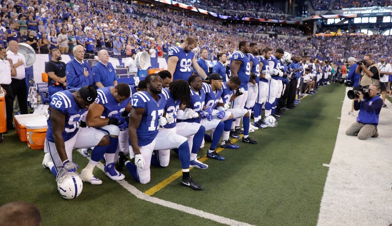 Members of the Indianapolis Colts take a knee during the Nation Anthem before an NFL football game against the Cleveland Browns in Indianapolis, Sunday, Sept. 24, 2017. (AP Photo/Darron Cummings)