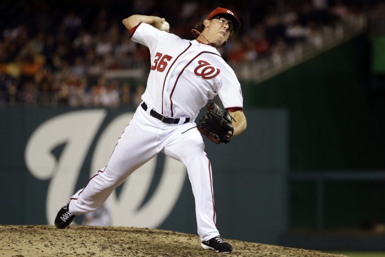 Washington Nationals relief pitcher Tyler Clippard delivers against the Milwaukee Brewers during the ninth inning of a baseball game at Nationals Park in Washington, Friday, Sept. 21, 2012. The Brewers won 4-2. (AP Photo/Jacquelyn Martin)