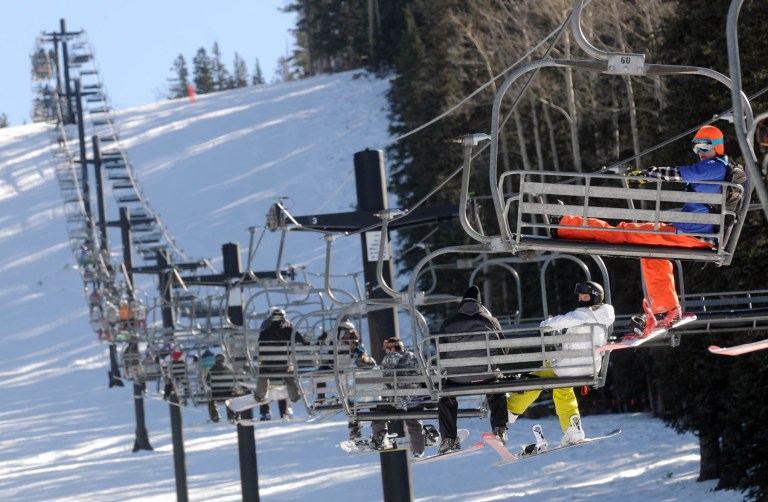   This Dec. 9, 2011 photo shows chairlifts at the Arizona Snowbowl near Flagstaff, Ariz., carrying skiers uphill. The resort is set to make snow this year, if needed. American Indian tribes have argued that snowmaking violates their religious rights on a mountain they consider sacred and that using treated wastewater will make people sick. (AP Photo/Arizona Daily Sun, Josh Biggs)  