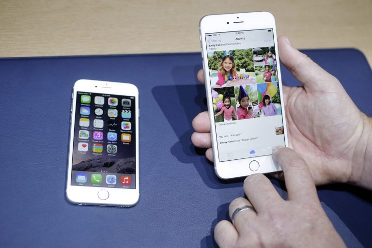FILE - This Sept. 9, 2014 file photo shows the iPhone 6, at left, and iPhone 6 plus during a new product release in Cupertino, Calif. Selling your old phone online or to companies that buy back used models can often offer a better return than your wireless provider. (AP Photo/Marcio Jose Sanchez, File)