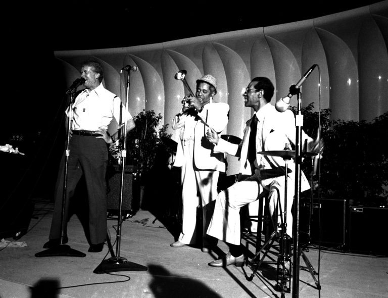 President Jimmy Carter joins Dizzy Gillespie and drummer Max Roach in singing a version of Gillespie's tune 