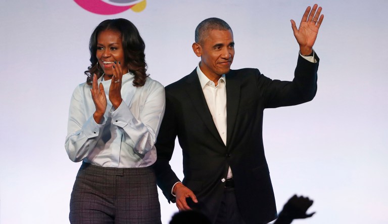 FILE - In this Oct. 13, 2017 file photo, former President Barack Obama, right, and former first lady Michelle Obama arrive for the first session of the Obama Foundation Summit in Chicago. Barack Obama and Netflix reportedly are negotiating a deal for the former president and his wife, Michelle, to produce shows exclusively for the streaming service. The proposed deal was reported Friday, March 9, 2018, by The New York Times, which cited people familiar with the discussions who were not identified.