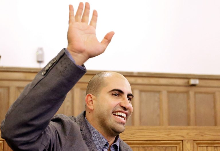 Steve Salaita, a professor who lost a job offer from the University of Illinois over dozens of profane Twitter messages that critics deemed anti-Semitic, speaks to students and reporters during a news conference at the University of Illinois campus Tuesday, Sept.  9, 2014, in Champaign Ill.  (AP Photo/Seth Perlman)