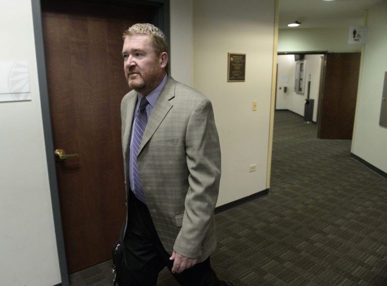 Daniel King, defense attorney for James Holmes, arrives at the Arapahoe County Justice Center for a hearing on Thursday, May 29, 2014 in Centennial, Colo.  The hearing will focus on how prospective jurors should be interviewed and what they should be asked in a written questionnaire. James Holmes pleaded not guilty by reason of insanity to charges of killing 12 people and injuring 70 in the July 2012 attack. Prosecutors are seeking the death penalty. Jury selection is scheduled to start in October, and the judge has said it could take up to three months.  (AP Photo/The Denver Post, Andy Cross, Pool)