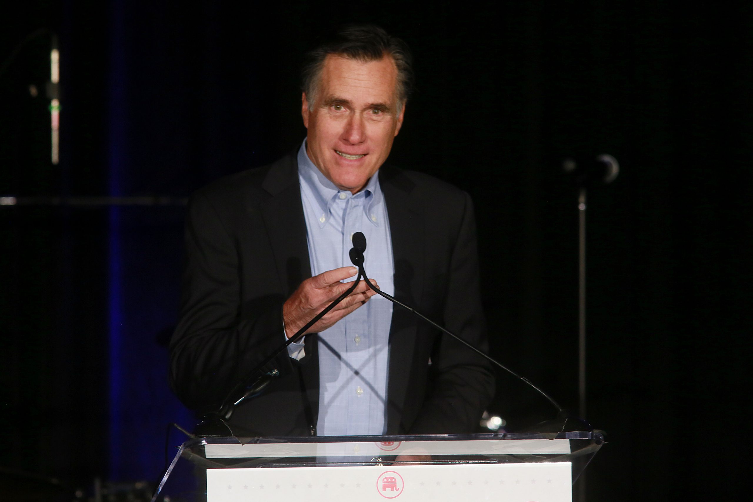 Mitt Romney hits back at Harry Reid