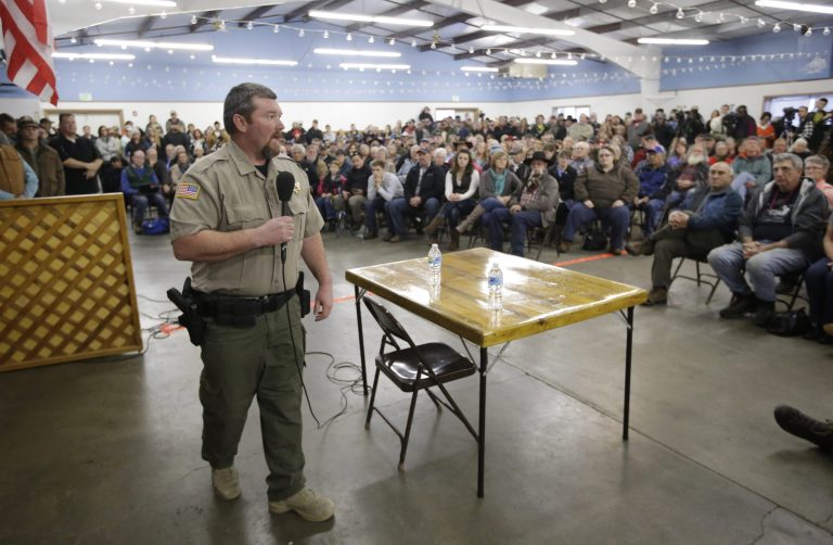 Harney County Sheriff David Ward listens to concerns during the community meeting at the Harney County fairgrounds in Burns, Ore. (AP Photo/Rick Bowmer)