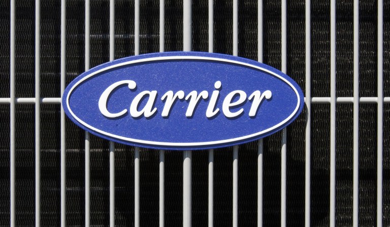 This April 21, 2009, file photo shows the Carrier logo on an air conditioning unit in Omaha, Neb. Carrier announced after President Trump's election that it had struck a deal with the president to keep the jobs in the U.S. instead of moving them to Mexico. (AP Photo/Nati Harnik, File)