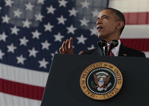 President Barack Obama speaks in the 440th Structural Maintenance Hangar at Fort Bragg, N.C., Wednesday, Dec. 14, 2011. 