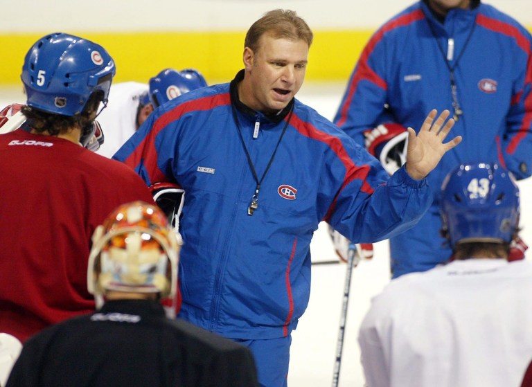   FILE - This Oct. 8, 2002 file photo shows Montreal Canadiens coach Michel Therrien gesturing during a team practice in Montreal. The Canadiens have hired Therrien as their coach again. He was fired by the Canadiens during the 2002-03 season. (AP Photo/Paul Chiasson, File)  