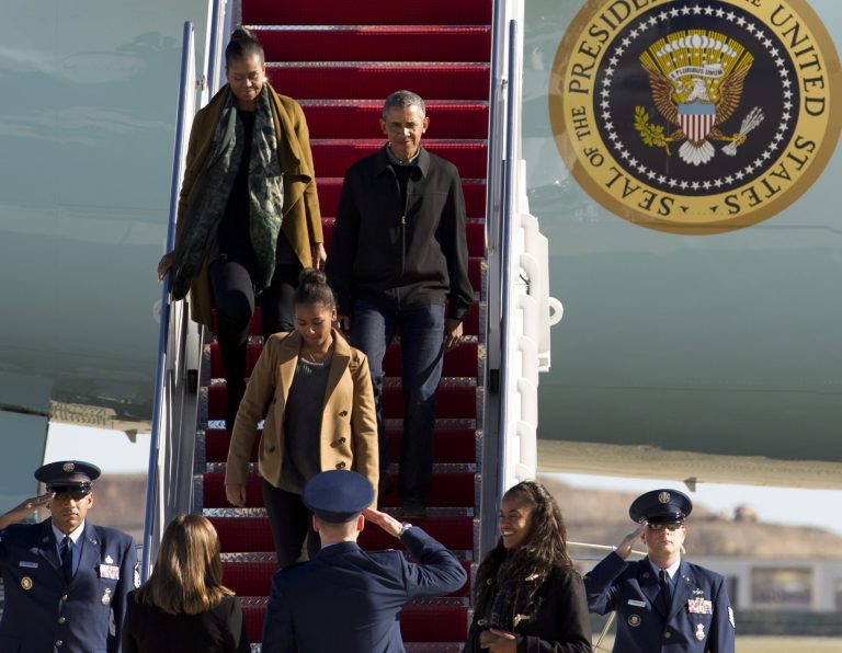 President Barack Obama, first lady Michelle Obama and their daughters Sasha and Malia arrive at Andrews Air Force Base, Md., Sunday, Jan. 3, 2016, as they return from vacation in Hawaii. (AP Photo/Jose Luis Magana)