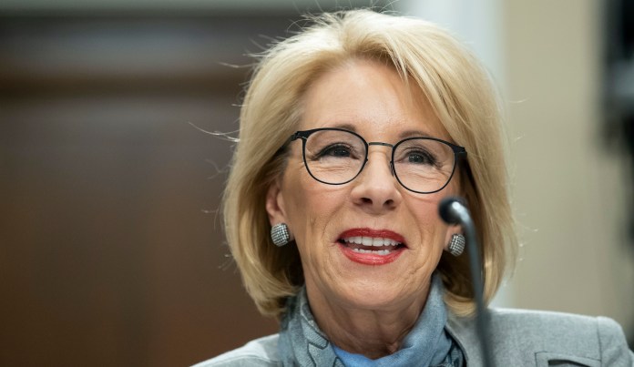 U.S. Education Secretary Betsy DeVos talks with students in a sixth grade science class at Cameron Middle School Monday, April 1, 2019, in Nashville, Tenn. DeVos said she's encouraged by Tennessee's latest push to expand school vouchers throughout the state and said she's cheering on lawmakers to make the right choice.