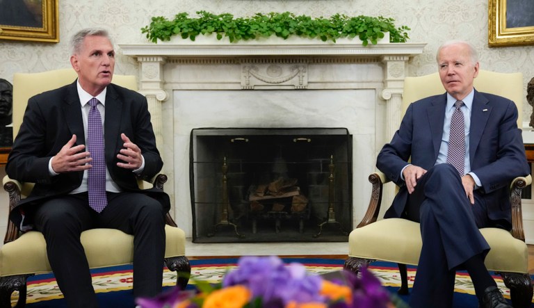 President Joe Biden talks with House Speaker Kevin McCarthy (R-CA) in Washington, March 17, 2023. There are stark differences in how President Joe Biden and House Speaker Kevin McCarthy want to shore up the government's finances.