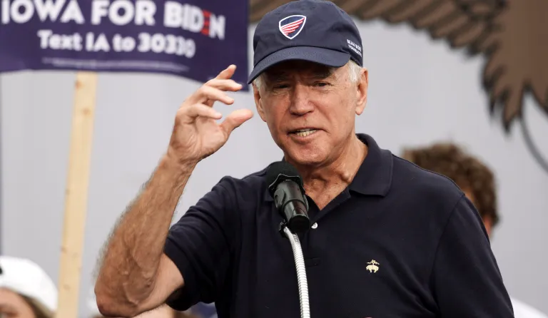 Democratic presidential candidate and former Vice President Joe Biden puts on a Beau Biden Foundation hat while speaking at the Polk County Democrats Steak Fry, in Des Moines, Iowa, Saturday, Sept. 21, 2019.