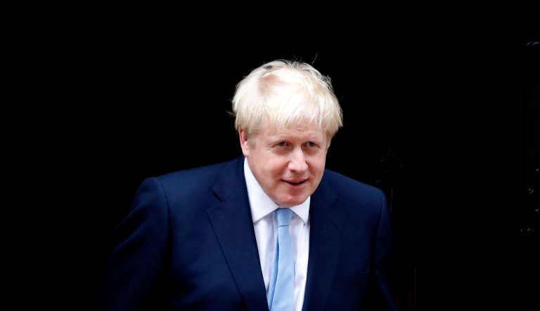Britain's Prime Minister Boris Johnson leaves the door to welcome King Abdullah II of Jordan at 10 Downing Street in London, Wednesday, Aug. 7, 2019. Johnson holds bilateral talks and a working lunch with the King of Jordan.