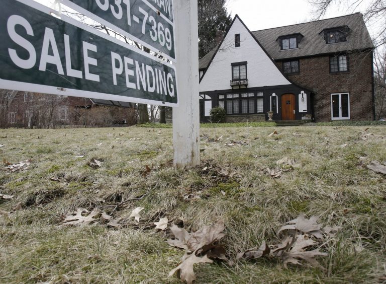 FILE - This Friday, March 21, 2014 file photo shows a home for sale in Shaker Heights, Ohio. Freddie Mac releases weekly mortgage rates on Thursday, June 26, 2014. (AP Photo/Tony Dejak, File)