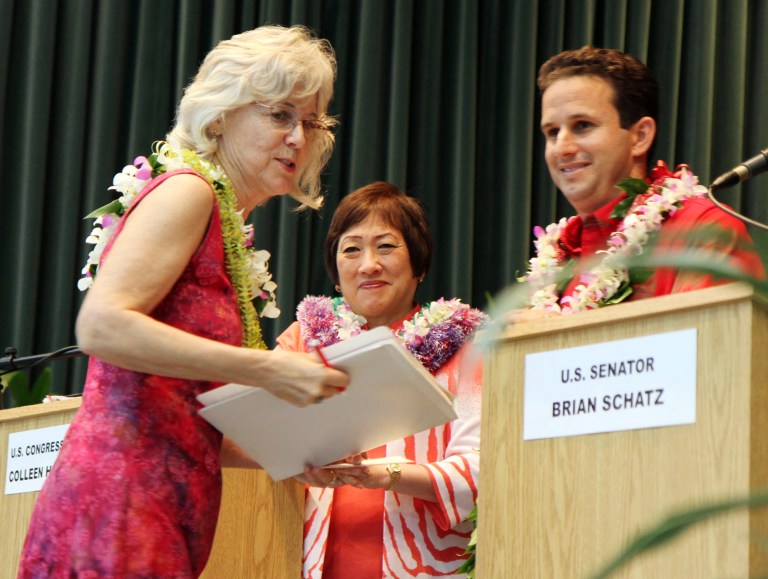Moderator Sherry Bracken, left, goes over some rules with U.S. Sen. Brian Schatz and U.S. Congresswoman Colleen Hanabusa before a debate Wednesday, July 2, 2014 in Hilo, Hawaii, as they compete in the Democratic primary for U.S. Senate. (AP Photo/Hawaii Tribune-Herald, Tim Wright)