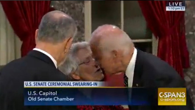 Vice President Joe Biden gives Sen. Chuck Grassley's wife a kiss. (Screen shot courtesy of Daniel Dale of the Toronto Star, via Twitter)