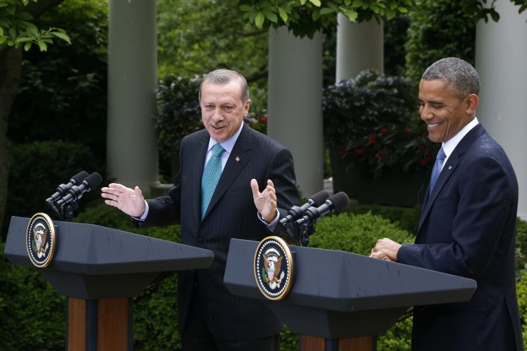 President Barack Obama smiles as Turkish Prime Minister Recep Tayyip Erdogan speaks during their joint news conference in the Rose Garden of the White House in Washington, Thursday, May 16, 2013. (AP Photo/Charles Dharapak)