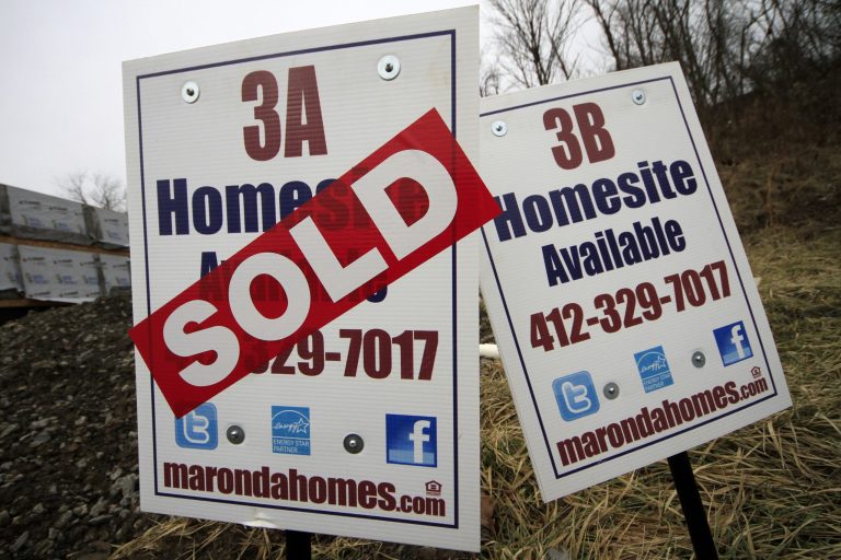 FILE - In this Monday, Jan. 13, 2014, photo, a sold sign is placed on a homesite in the Grace Manor townhouse development in Robinson Township, Pa. Freddie Mac, the mortgage company, releases weekly mortgage rates on Thursday, May 8, 2014.  (AP Photo/Gene J. Puskar, File)
