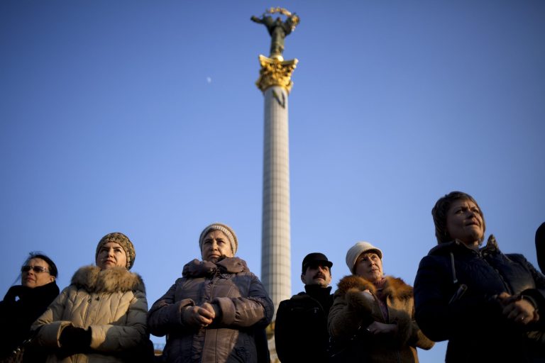 Ukrainians sing attend commemorations for writer and Ukrainian nationalist Taras Shevchenko in Kiev's Independence Square, Ukraine, Sunday, March 9, 2014. As separatists in Crimea kept up pressure for unification with Moscow, Ukraine solemnly commemorated the 200th anniversary of the birth of its greatest poet, with the prime minister vowing not to give up 
