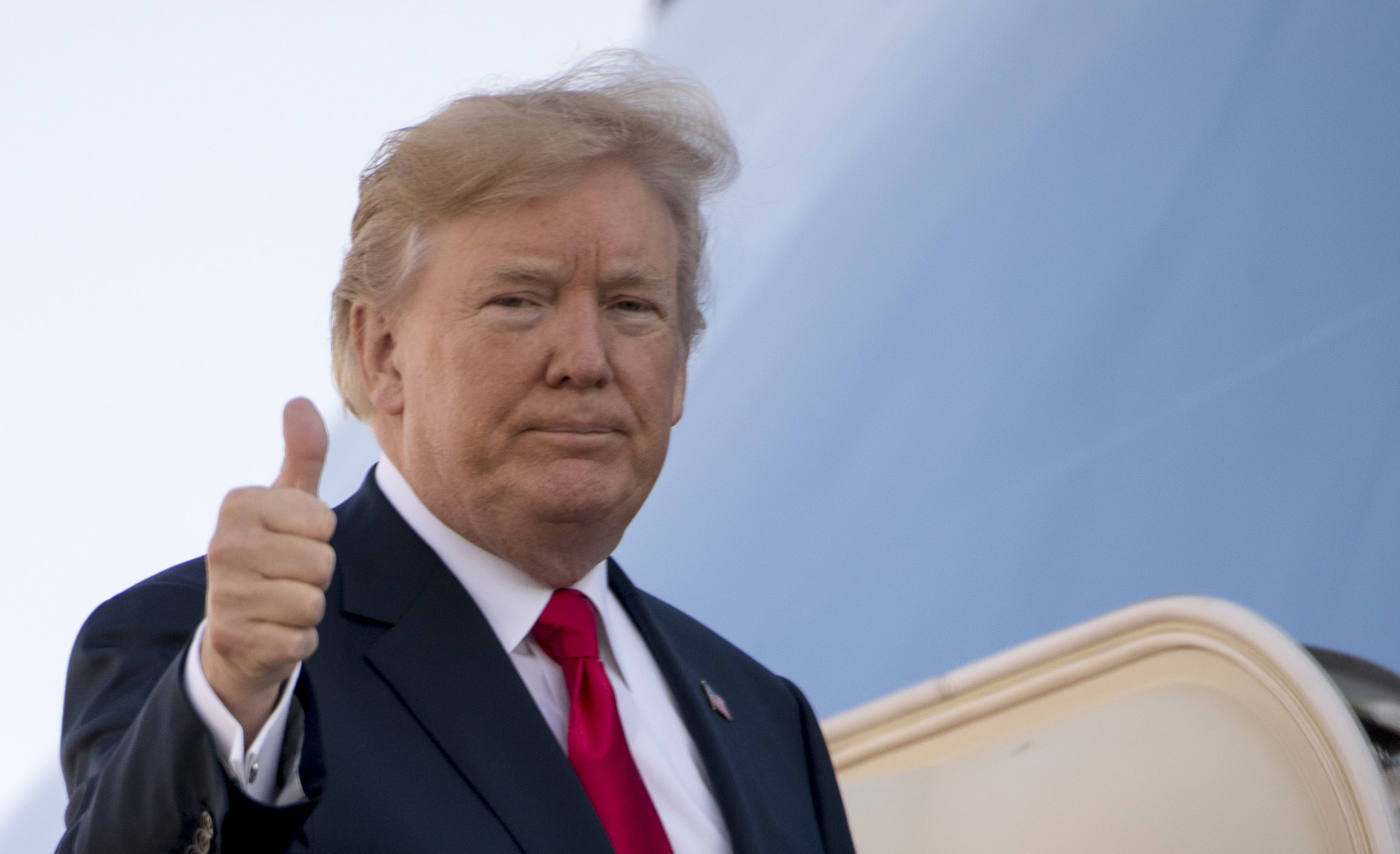 Trump stops at his hotel in Hawaii before departing for Asia