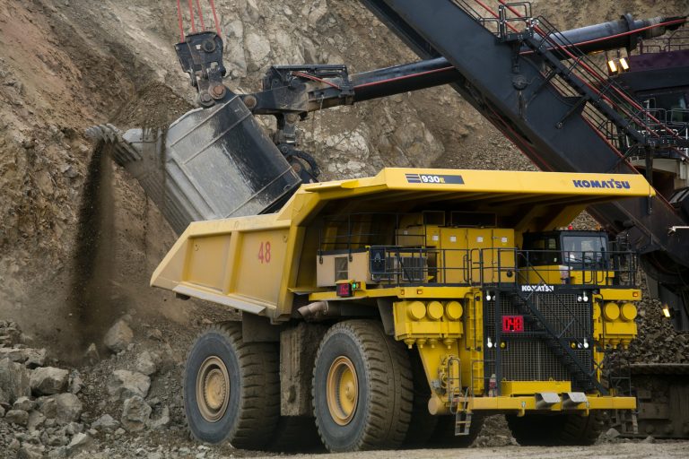 Trucks move tons of ore at the open pit mining area as a rainstorm approaches at the Oyu Tolgoi mine October 11, 2012 in the south Gobi desert, Khanbogd region, Mongolia. (Photo by Paula Bronstein/Getty Images)