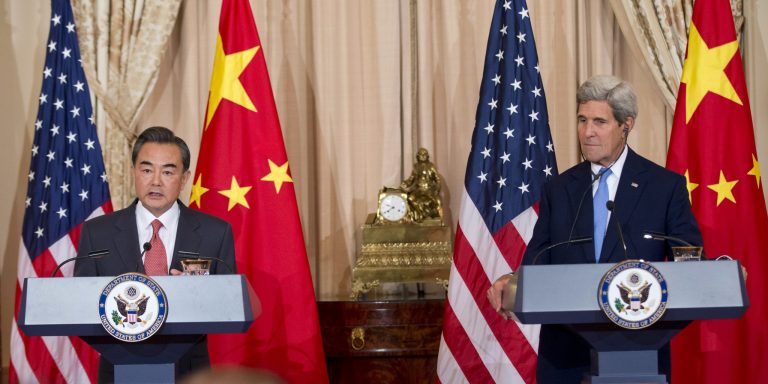John Kerry, when he was secretary of state in the Obama administration, listened as Chinese Foreign Minister Wang Yi spoke to reporters before a meeting at the State Department in 2014. 