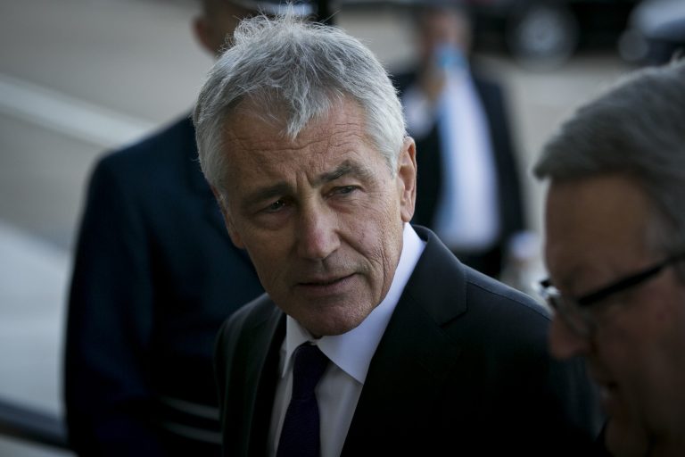 Defense Secretary Chuck Hagel looks on while welcoming New Zealand's Minister of Defense Gerry Brownlee, during an honor cordon at the Pentagon, Monday, Nov. 24, 2014. (Graeme Jennings/Examiner)