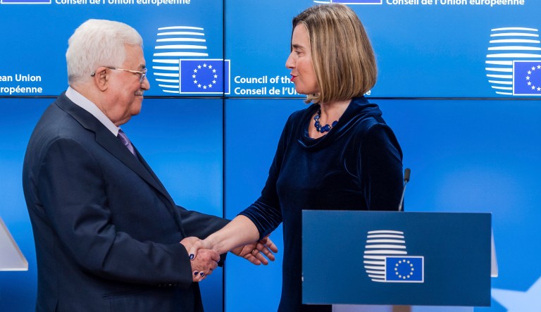 European Union foreign policy chief Federica Mogherini, right, shakes hands with Palestinian President Mahmoud Abbas after they addressed the media at the EU Council in Brussels on Monday, Jan. 22, 2018. (AP Photo/Geert Vanden Wijngaert)