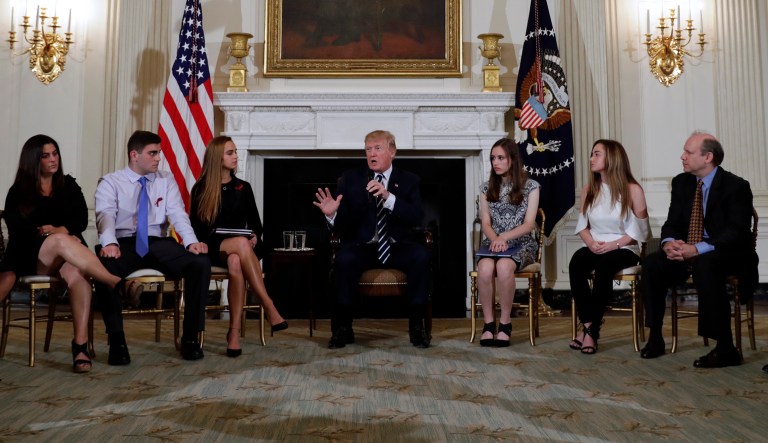 President Trump hosts a listening session with high school students, teachers and parents in the State Dining Room of the White House on Wednesday. (AP Photo/Carolyn Kaster)