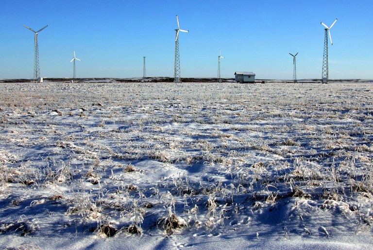 Turbines sit on a wind farm on the frozen tundra outside of the town of Kotzebue, Alaska. (AP Photo/Al Grillo)