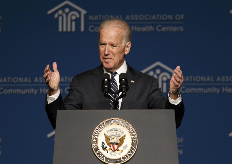 Vice President Joe Biden thanks the National Association of Community Health Centers for their work in helping people sign up for health care under the Affordable Care Act, during their meeting in Washington, Friday, March 21, 2014. Though he did not talk specifically about the Ukraine crisis, Biden said he was nursing a sinus infection following his trip this week to Poland and Lithuania to reassure jittery Eastern European allies unnerved by the Russian takeover of Crimea in Ukraine.  (AP Photo/J. Scott Applewhite)