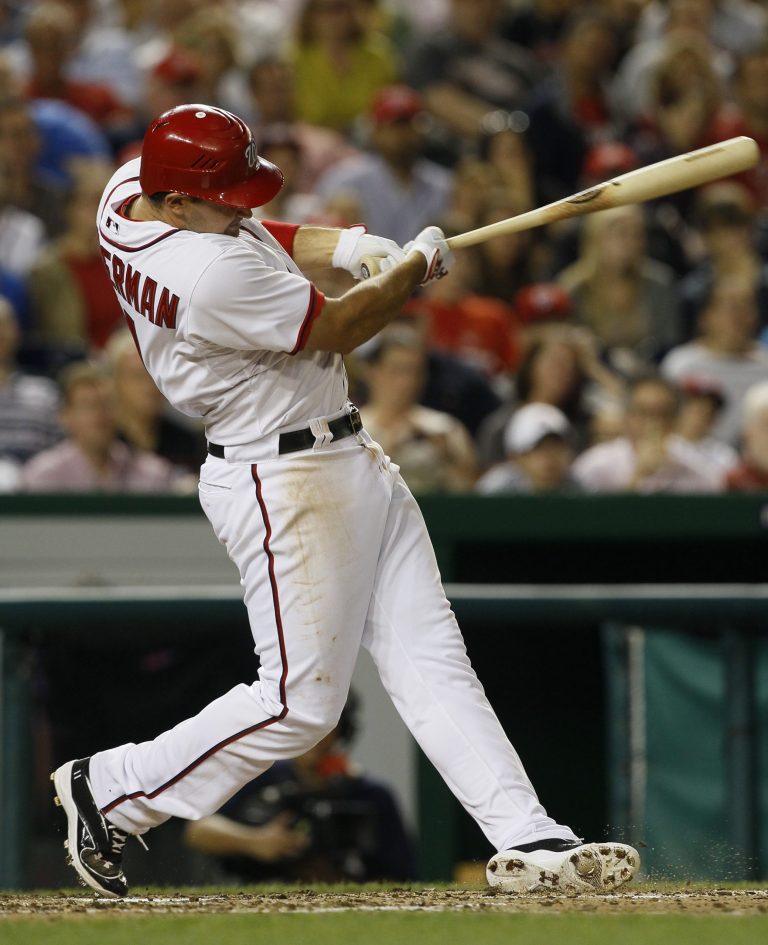 CORRECTS TO FRIDAY NOT THURSDAY - Washington Nationals' Ryan Zimmerman hits a three-run home run in the fourth inning of a baseball game against the Atlanta Braves, Friday, July 20, 2012, in Washington. (AP Photo/Carolyn Kaster)