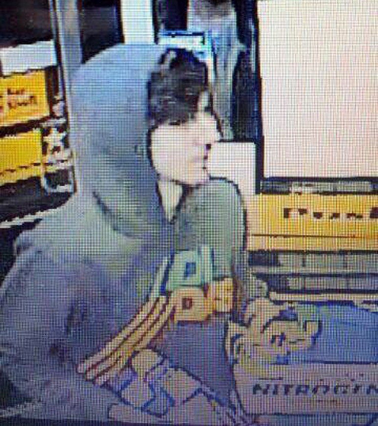 This surveillance photo released via Twitter Friday, April 19, 2013 by the Boston Police Department shows a suspect entering a convenience store that police are pursuing in Watertown, Mass.  Connecticut State Police say a vehicle believed to be linked to Dzhokhar Tsarnaev has been recovered. (AP Photo/Boston Police Department)