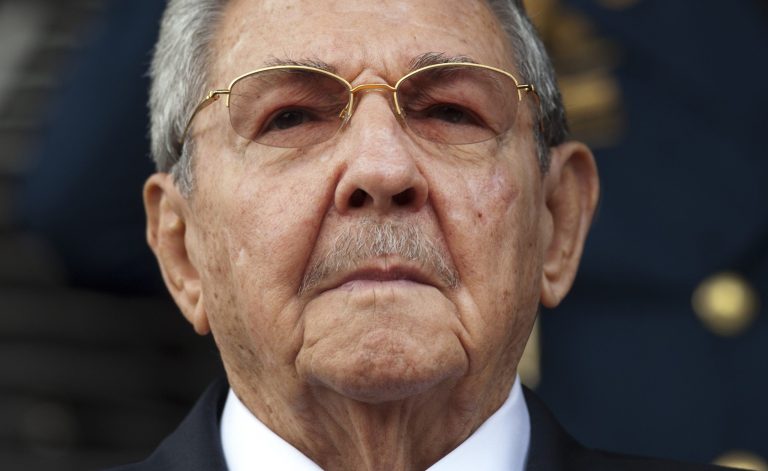 President Obama and Raul Castro briefly shook hands at a memorial service for Nelson Mandela in 2013. (AP Photo)Â 