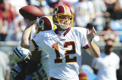 Mike McCarn/AP
In his first start since 2007, Redskins quarterback John Beck completed 22 of 37 passes for 279 yards and a touchdown and turned the ball over twice.