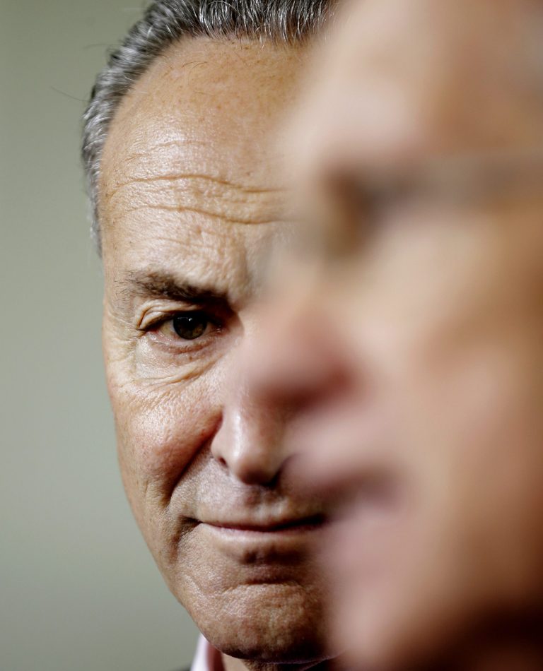 Sen. Charles Schumer, D-N.Y. listens at left, as Senate Majority Leader Harry Reid of Nev. speaks to members of the media outside the West Wing of the White House in Washington, Thursday, Oct. 10, 2013, following a meeting with President Barack Obama regarding the budget. (AP Photo/Pablo Martinez Monsivais)