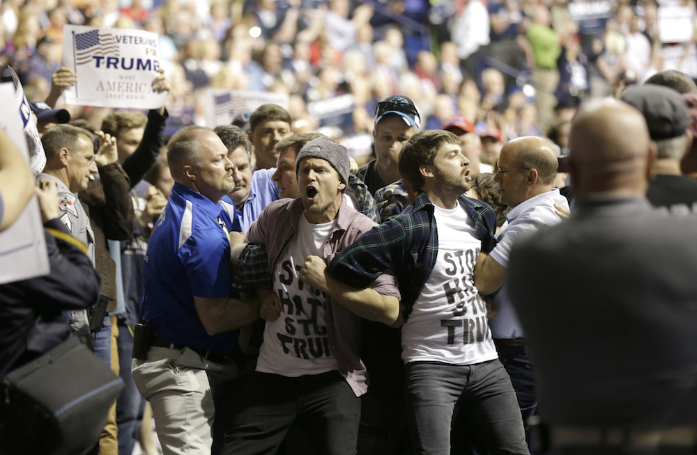 Video: Violence escalates at Trump rally with heckler left bloody