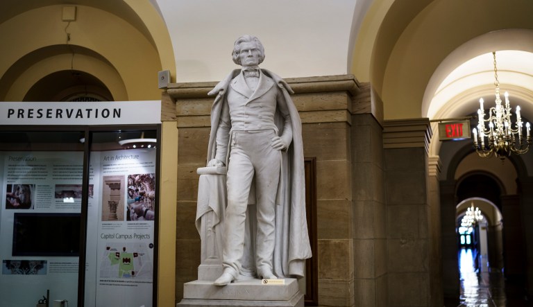 Who are the figures whose statues the House voted to remove?