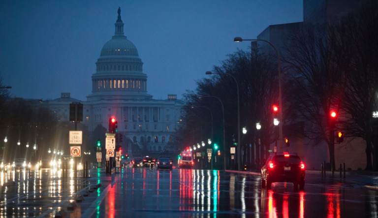 Rain falls on Pennsylvania Avenue in Washington, early Friday, March 31, 2017.