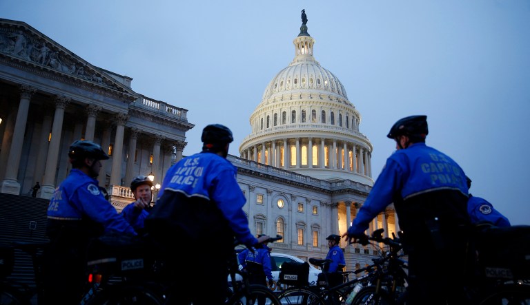 Police officers stand outside the U.S. Capitol building ahead of a joint session of Congress in Washington, D.C., U.S., on Tuesday, Feb. 28, 2017. President Donald Trump will press Congress to carry out his priorities for replacing Obamacare, jump-starting the economy and bolstering the nations defenses in an address eagerly awaited by lawmakers, investors and the public who want greater clarity on his policy agenda.