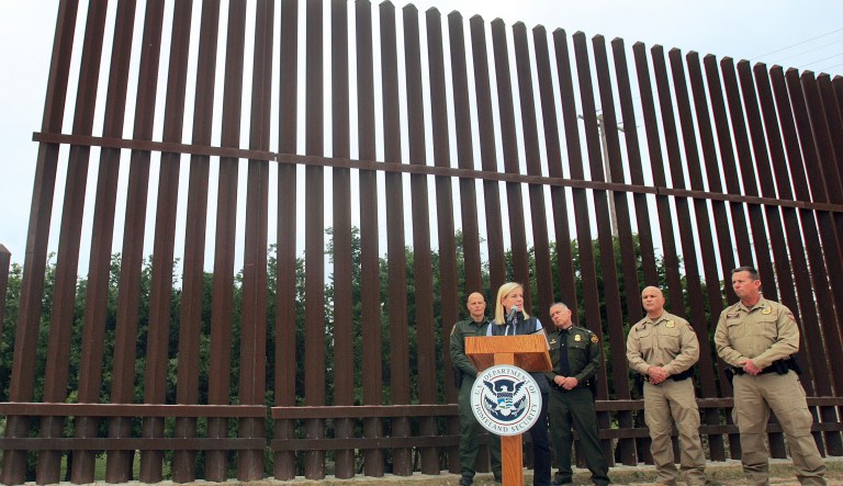 This pointless action is sure to have zero impact on the wall construction. (Joel Martinez/The Monitor via AP)